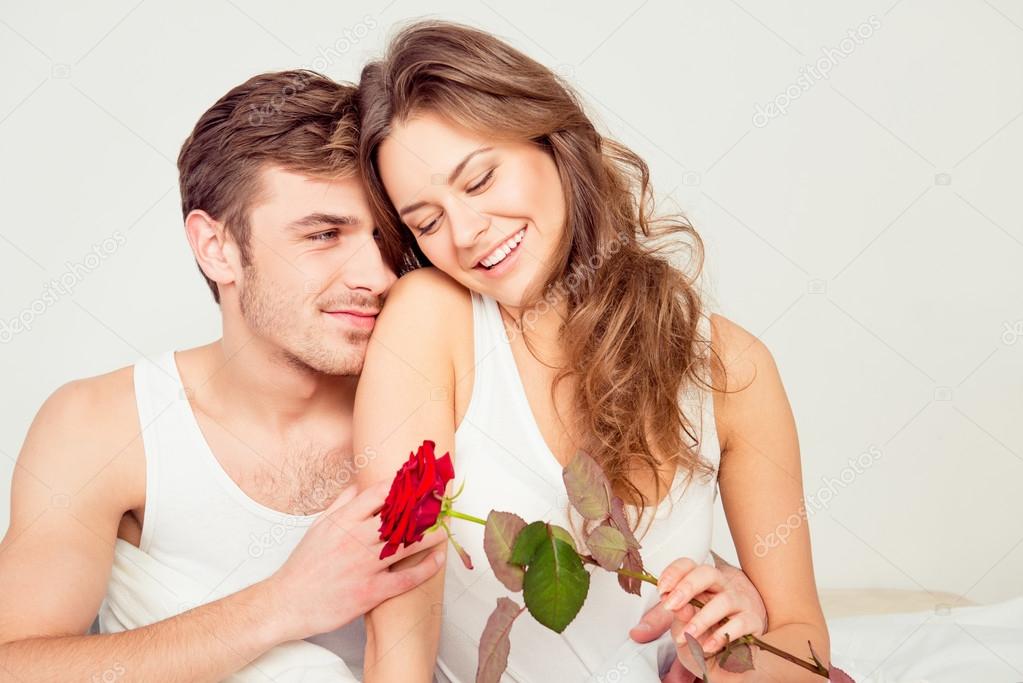 Happy Cute Couple In Love At Home Embracing Each Other With A Ro Stock Photo Image By C Deagreez1