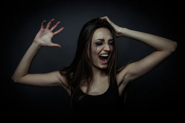 Portrait of a scared screaming girl, hands on the forehead — Stock Photo, Image