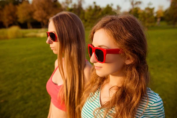 Two sexy  girls with red glasses — Stock Photo, Image