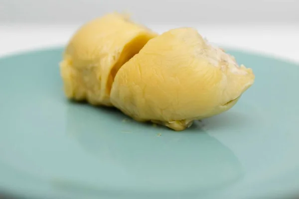 two sections of durians. The king of fruits in the Asian country