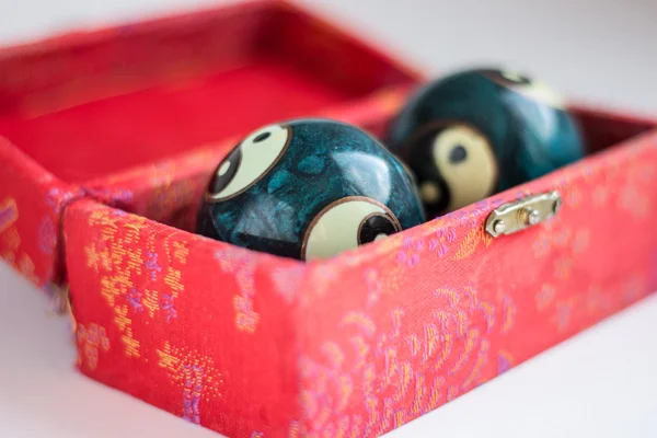 Two ying - yang balls in red box — Stock Photo, Image