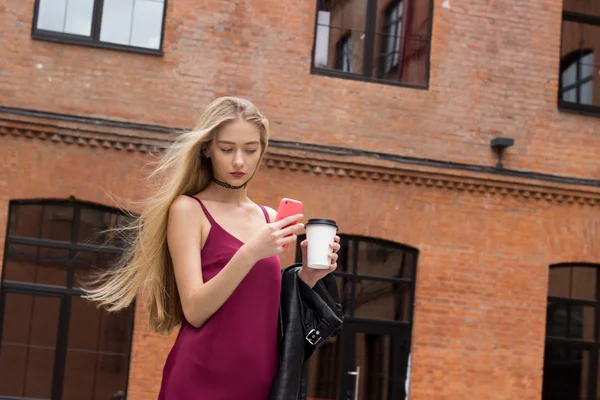 Young pretty blond girl with phone — Stock Photo, Image