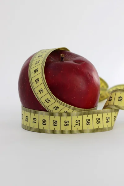 Metre-stick and apple — Stock Photo, Image