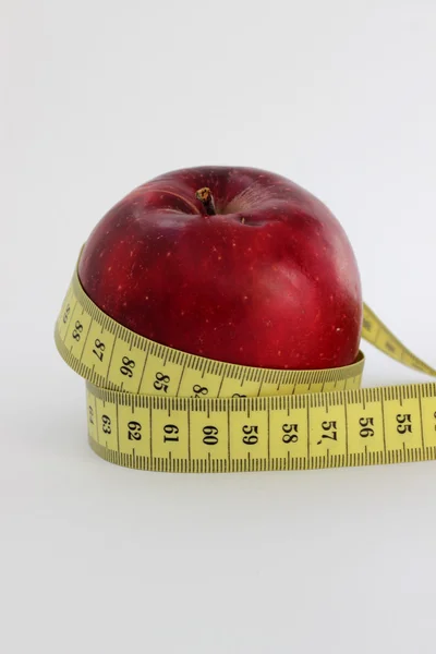 Metre-stick and apple — Stock Photo, Image