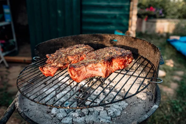 tomahawk steak fried on the grill in the garden