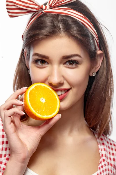 Girl holding an orange. — Stock Photo, Image