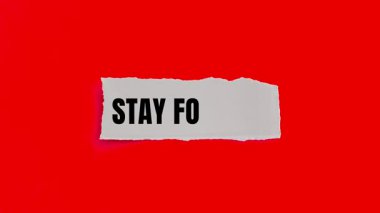 Stay Focused message written on ripped torn paper background. Conceptual Stay Focused symbol.