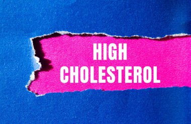 High cholesterol message written on ripped torn paper background. Conceptual High cholesterol symbol. Copy space.