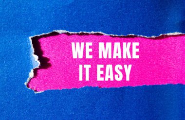We make it easy message written on ripped torn paper background. Conceptual We make it easy symbol. Copy space.