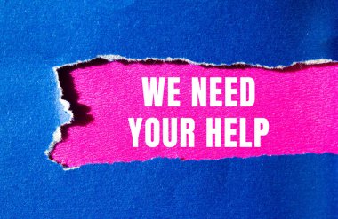 We need your help message written on ripped torn paper background. Conceptual We need your help symbol. Copy space.