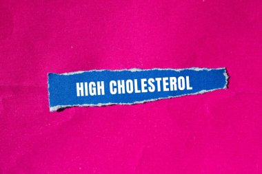 High cholesterol message written on ripped torn paper background. Conceptual High cholesterol symbol. Copy space.
