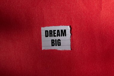 Dream Big message written on ripped torn paper background. Conceptual Dream Big symbol. Copy space.