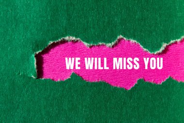 We will miss you message written on ripped torn paper background. Conceptual We will miss you symbol. Copy space.