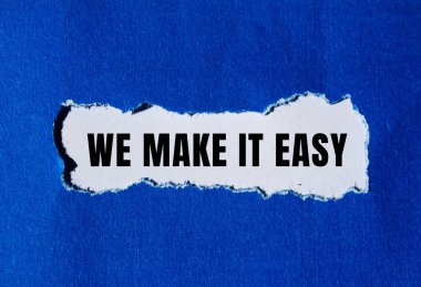 We make it easy message written on ripped torn paper background. Conceptual We make it easy symbol. Copy space.