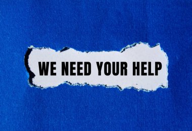 We need your help message written on ripped torn paper background. Conceptual We need your help symbol. Copy space.