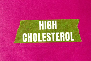 High cholesterol message written on ripped torn paper background. Conceptual High cholesterol symbol. Copy space.