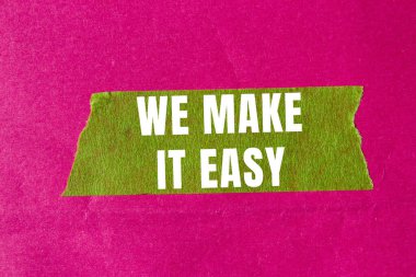 We make it easy message written on ripped torn paper background. Conceptual We make it easy symbol. Copy space.