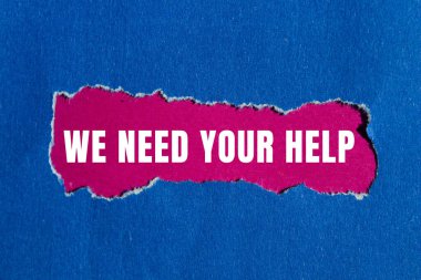 We need your help message written on ripped torn paper background. Conceptual We need your help symbol. Copy space.