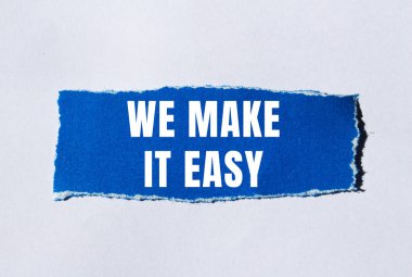 We make it easy message written on ripped torn paper background. Conceptual We make it easy symbol. Copy space.