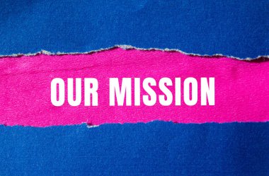 Our mission message written on ripped torn paper background. Conceptual Our mission symbol. Copy space.