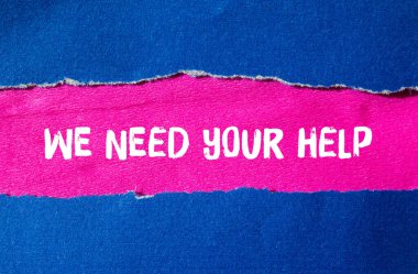 We need your help message written on ripped torn paper background. Conceptual We need your help symbol. Copy space.