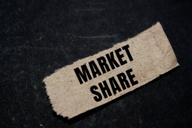 Market Share message written on ripped torn paper background. Conceptual Market Share symbol. Copy space.
