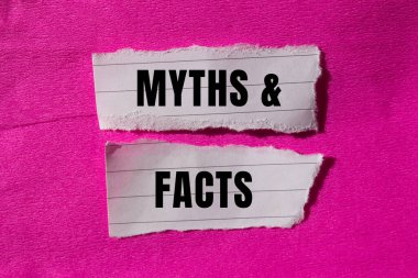Myths and facts message written on ripped torn paper background. Conceptual Myths and facts symbol. Copy space.