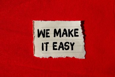 We make it easy message written on ripped torn paper background. Conceptual We make it easy symbol. Copy space.