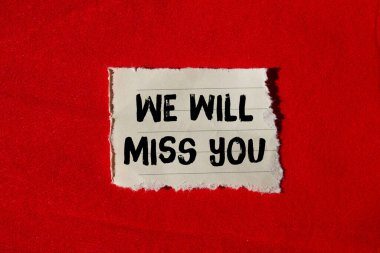 We will miss you message written on ripped torn paper background. Conceptual We will miss you symbol. Copy space.