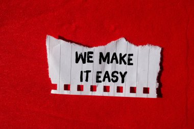 We make it easy message written on ripped torn paper background. Conceptual We make it easy symbol. Copy space.