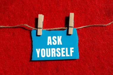 Ask yourself message written on ripped torn paper background. Conceptual Ask yourself symbol. Copy space.