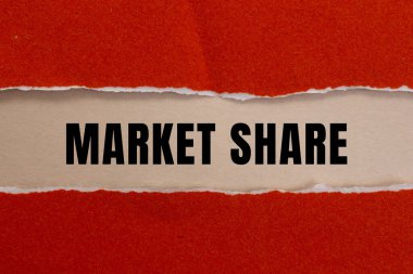 Market Share message written on ripped torn paper background. Conceptual Market Share symbol. Copy space.