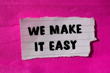 We make it easy message written on ripped torn paper background. Conceptual We make it easy symbol. Copy space.