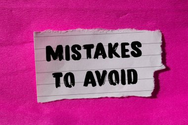 Mistakes to avoid message written on ripped torn paper background. Conceptual Mistakes to avoid symbol. Copy space.