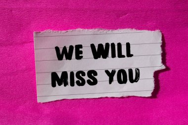 We will miss you message written on ripped torn paper background. Conceptual We will miss you symbol. Copy space.
