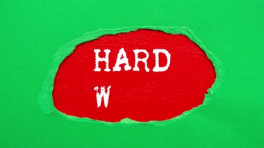 Hard Work message written on ripped torn paper background. Conceptual Hard Work symbol.