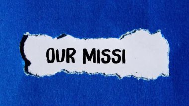 Our mission message writing on ripped torn paper background