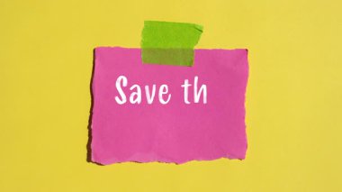 Save the date message writing on ripped torn paper background