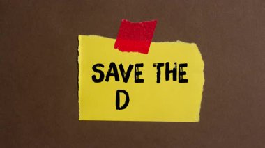 Save the date message writing on ripped torn paper background