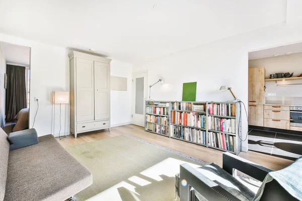 Living room with bookshelf and wardrobe — Stock Photo, Image