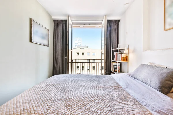 Spacious modern bedroom with balcony