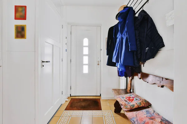 Hallway with clothes on rack