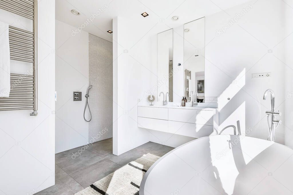 Bright white master bathroom with tub