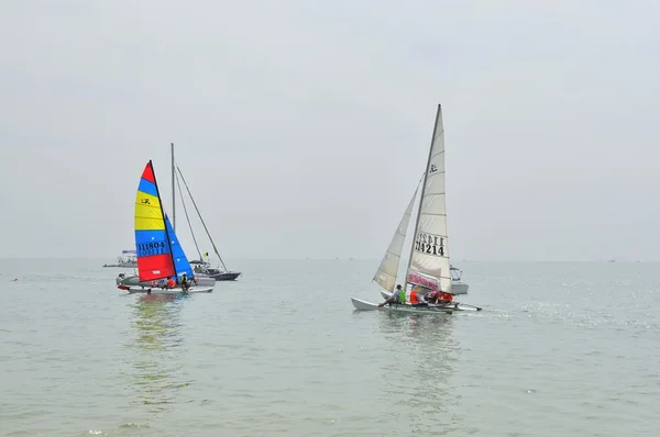 Nha Trang, Vietnam - July 11, 2015: Sailing boats are ready for a race in the Nha Trang bay