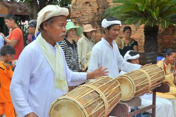 Nha Trang, Vietnam - July 11, 2015: Two old men are performing the traditional drums technique of champa at the Po Nagar temple in Nha Trang