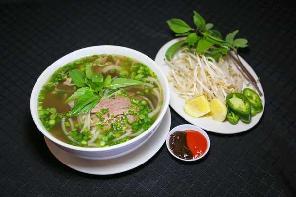 Bun bo or Vietnamese vermicelli noodle soup with minced beef — Stock Image Bun bo or Vietnamese vermicelli noodle soup with minced beef Royalty Free Stock Images