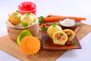 Chicken chinese dumplings with carrot, sliced tomato and herbs o clipart