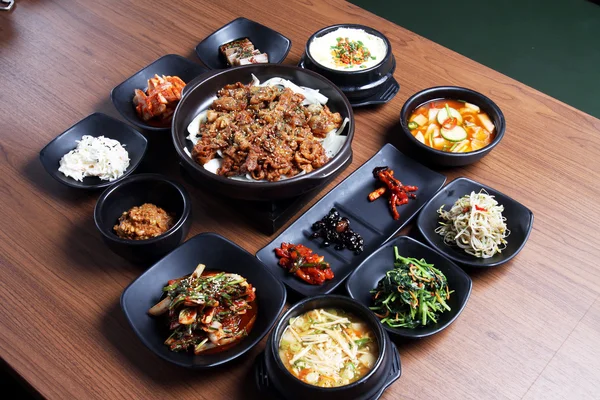 A traditional korean tray meal on wooden table — Stock Photo, Image