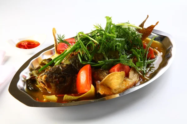 Steamed barramundi fish with onion and herbs in Hong Kong style — Stock Photo, Image