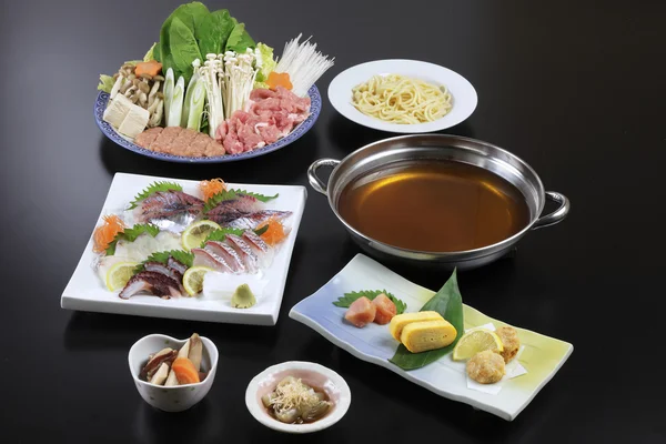 Japanese hot pot of sushi, beef, pork, mushroom, tofu, noodle an — Stock Photo, Image